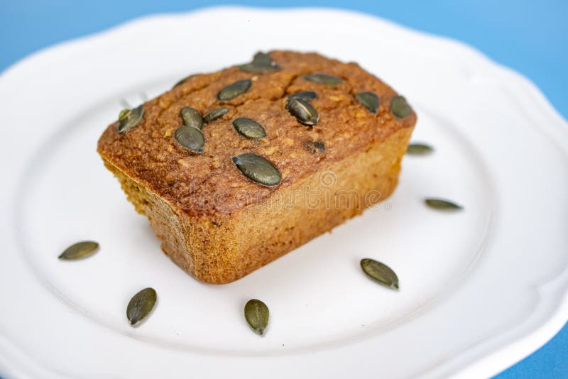 GlutenFree Pumpkin Bread with Pumpkin Seed in White Plate Stock Photo