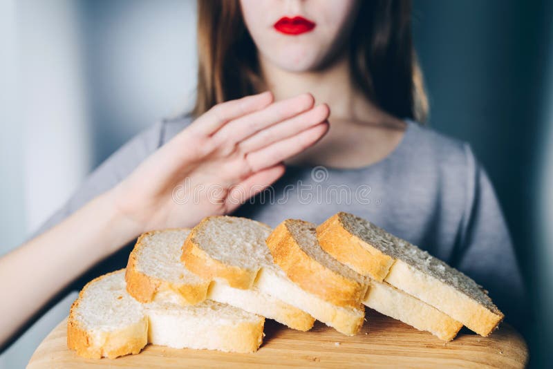 Gluten intolerance and diet concept. Young girl refuses to eat w stock photo Gluten intolerance and diet concept. Young girl refuses to eat w stock photo
