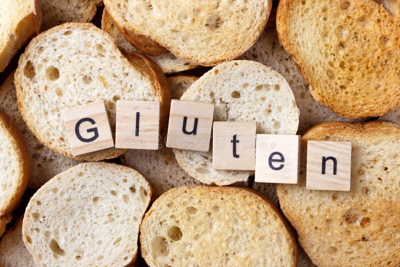 Glutentekst op Achtergrond van vele kleine ronde beschuiten Hoogste mening stock afbeeldingen Glutentekst op Achtergrond van vele kleine ronde beschuiten Hoogste mening stock afbeeldingen