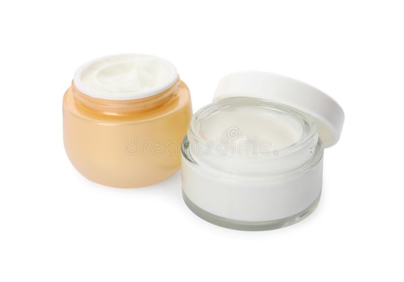 Gläser aus Creme auf weißem Hintergrund stockfotos