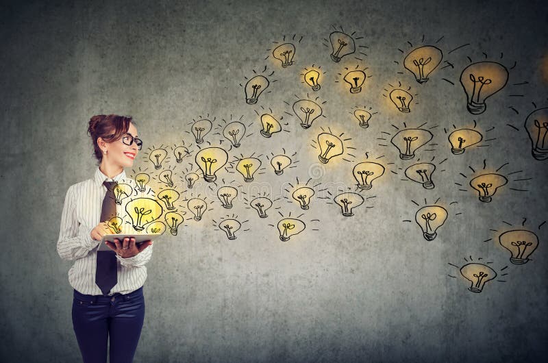 Side view of young business woman holding tablet computer with brilliant ideas. Side view of young business woman holding tablet computer with brilliant ideas