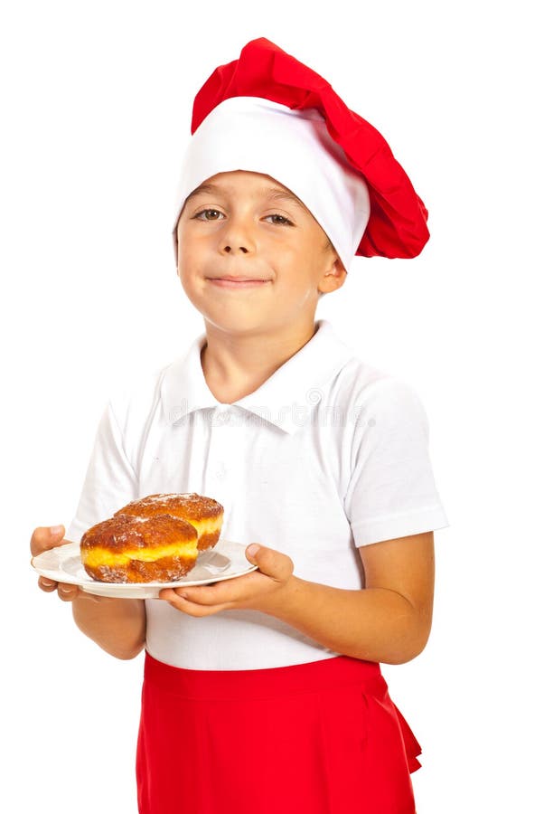 Glücklicher Chefjunge, der Schaumgummiringe hält stockfotografie Glücklicher Chefjunge, der Schaumgummiringe hält stockfotografie
