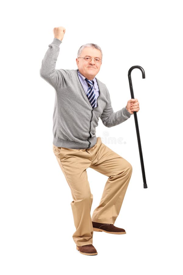 Glücklicher älterer Mann, der einen Stock anhält und Glück gestikuliert stockbild Glücklicher älterer Mann, der einen Stock anhält und Glück gestikuliert stockbild