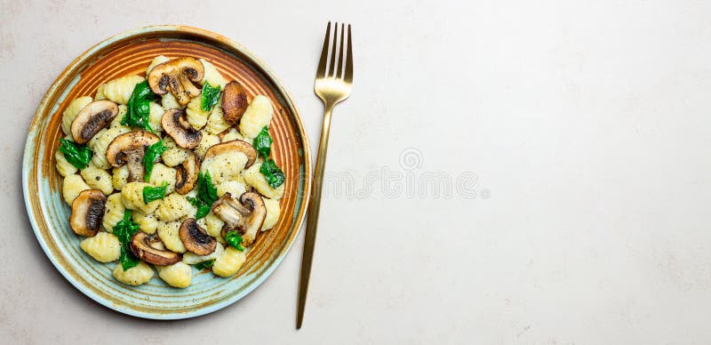 Gnocchi in a Creamy Sauce with Mushrooms and Spinach. Healthy Eating