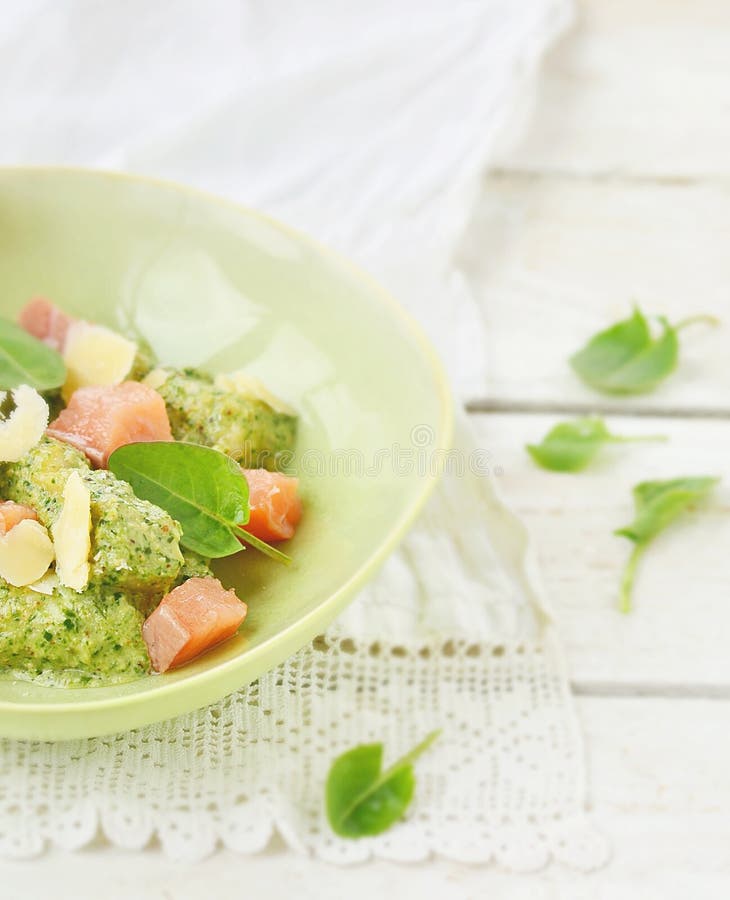 Gnocchi with Pesto Sauce and Smoked Salmon Stock Image - Image of