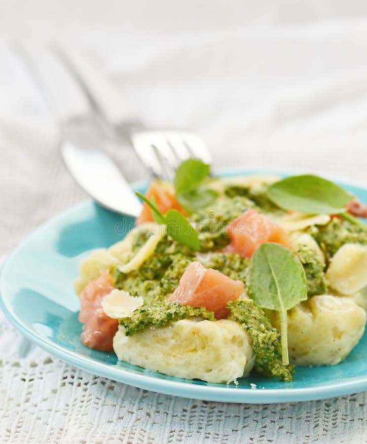 Gnocchi with Pesto Sauce and Smoked Salmon Stock Image - Image of food