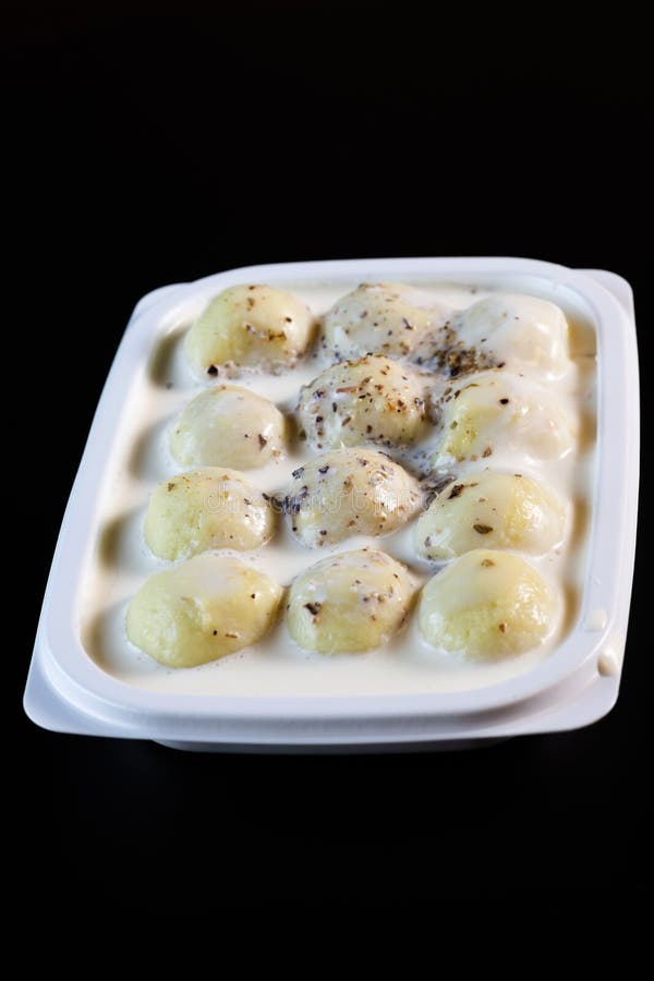 Gnocchi with white sauce stock photo. Image of cheese 197584320