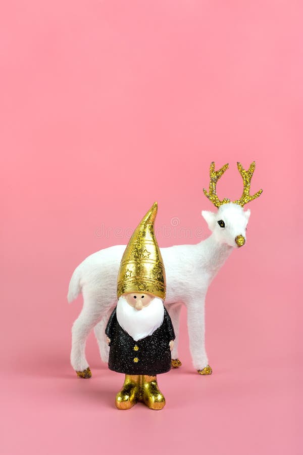 Gnome, deer in black, white, golden color on pink background Happy New Year, Merry Christmas concept Holiday card