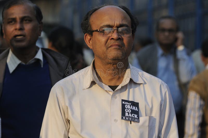KOLKATA -JANUARY 24: A man standing with Go Back Obama badge stuck to his t-shirt to protest Obama's three day visit India to attend India's Republic Day parade on January 24, 2015 in Kolkata,India. KOLKATA -JANUARY 24: A man standing with Go Back Obama badge stuck to his t-shirt to protest Obama's three day visit India to attend India's Republic Day parade on January 24, 2015 in Kolkata,India.