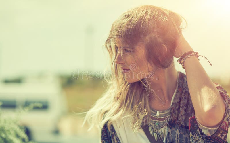 Go find yourself out there. a bohemian young woman spending a summer day outside. royalty free stock image
