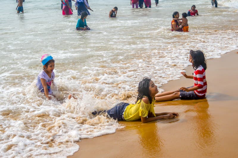 GOA, INDIA, Asia. MAY 2017: Selective Focus: Image of Young Asian preschool boy and girl, brother and sister, playing with water o