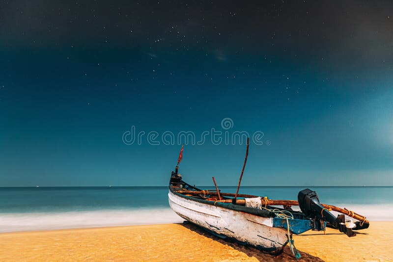 Goa, India. Real Night Sky Stars. Natural Starry Sky Blue Color Above Sea Seascape Ocean Beach. Background. Parked Old