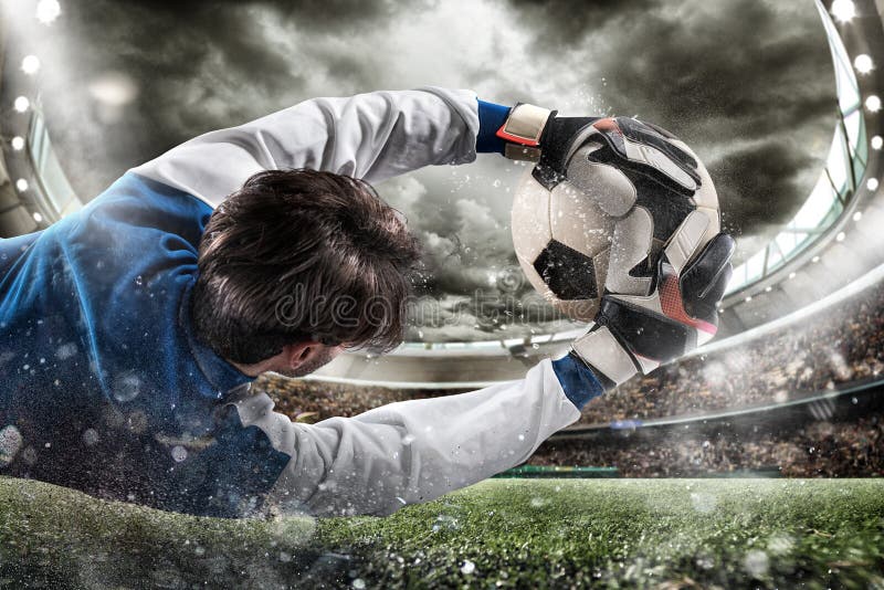 Goalkeeper catches the ball in the stadium stock photography Goalkeeper catches the ball in the stadium stock photography
