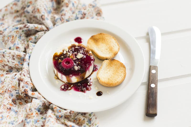 Goat Cheese with Berry Sauce, Balsamic Vinegar and Walnuts Stock Image