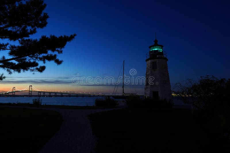 Goat Island Lighthouse with the Newport Bridge in the Background Stock