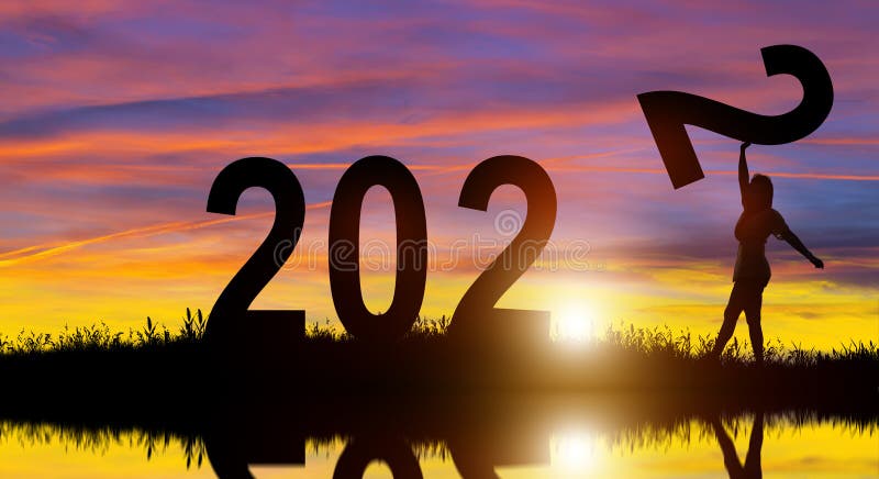 Silhouette women holding number 2 on the hill while celebrating 2022 years in the sunrise background. Merry Christmas and Happy New Year. Silhouette women holding number 2 on the hill while celebrating 2022 years in the sunrise background. Merry Christmas and Happy New Year