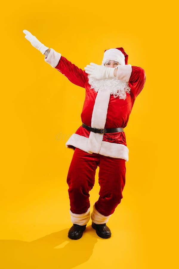 volgens Wijzigingen van Hover Goedaardige Kerstman in Een Grappig Podium, Waardoor Dab, Studio is  Neergeschoten Stock Foto - Image of kostuum, vrolijk: 164273446