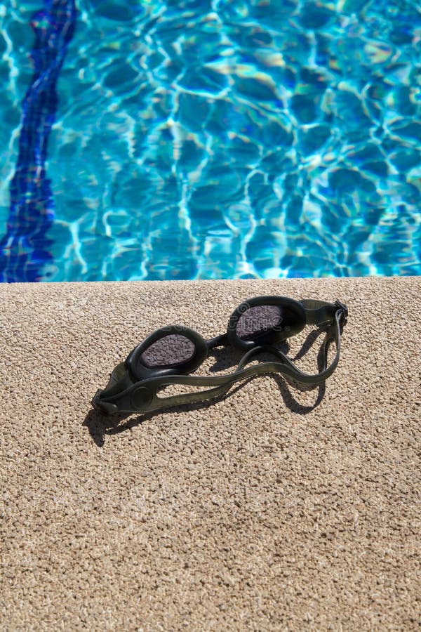 Goggles on Curb of Swimming Pool Stock Image - Image of exercise, pool ...