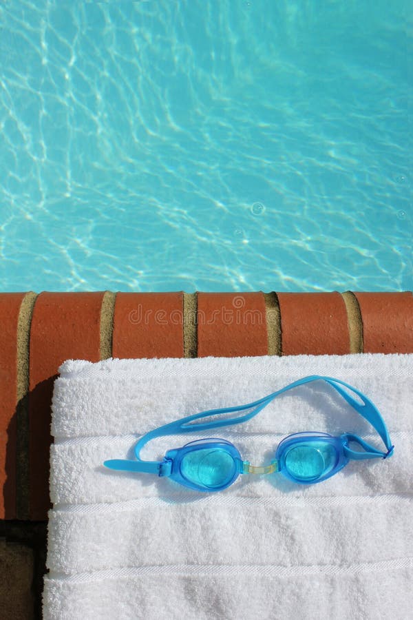 Goggles At The Edge Of A Swimming Pool Stock Image - Image of white ...