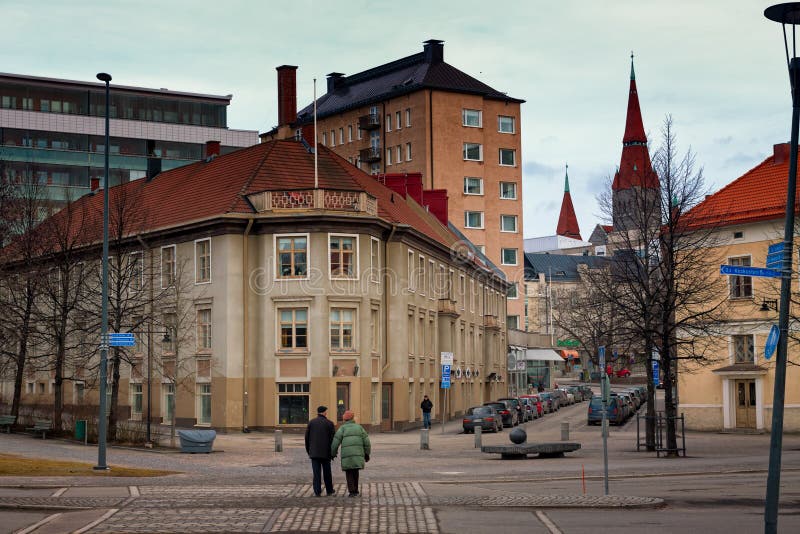 Going To The Church. An old couple on their way to the church. They are on a street in Tampere, Finland. Tampere is the second largest city in Finland stock images Going To The Church. An old couple on their way to the church. They are on a street in Tampere, Finland. Tampere is the second largest city in Finland stock images