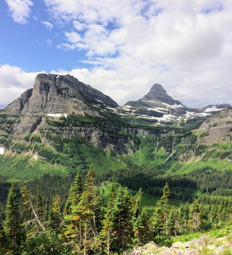 Going to the Sun Road, View of Landscape, snow fields In Glacier National Park around Logan Pass, Hidden Lake, Highline Trail, whi stock image Going to the Sun Road, View of Landscape, snow fields In Glacier National Park around Logan Pass, Hidden Lake, Highline Trail, whi stock image