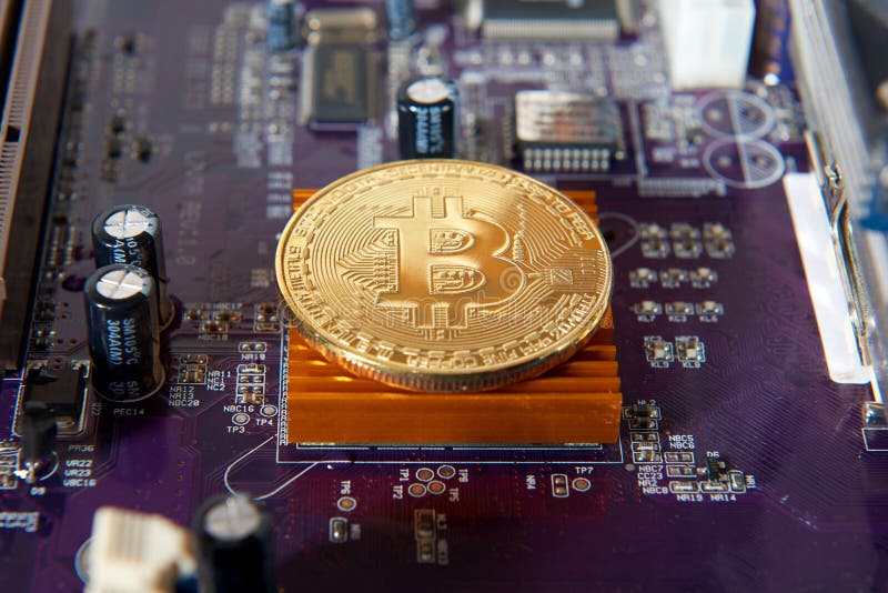 Gold Bitcoin electronic computer processor board royalty free stock photo