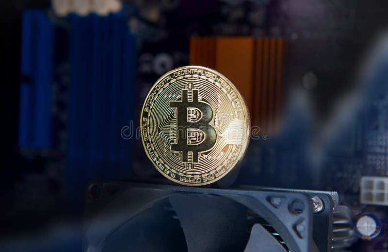 Gold Bitcoin electronic computer processor board stock photo