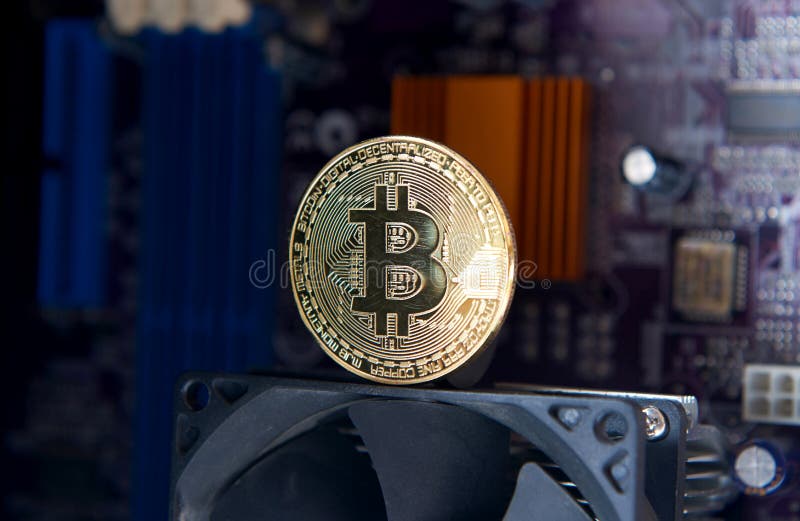 Gold Bitcoin electronic computer processor board stock photo