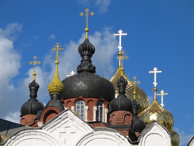 Gold and black domes and crosses.