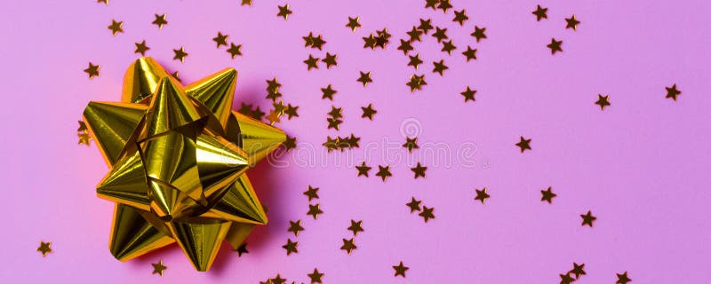 Gold Bow with Star Glitter Confetti on Pink Paper Background Stock Image -  Image of party, polka: 200592317