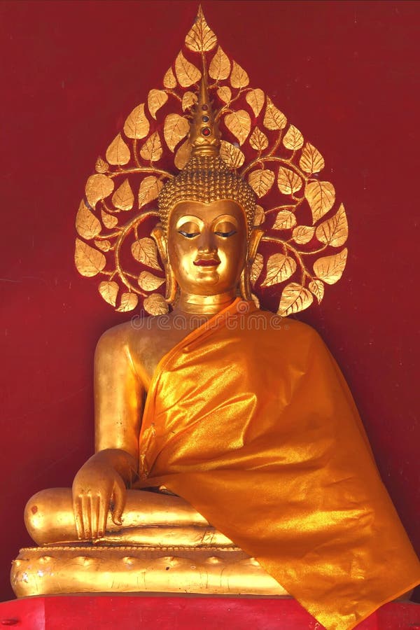 Gold buddha with red wall background