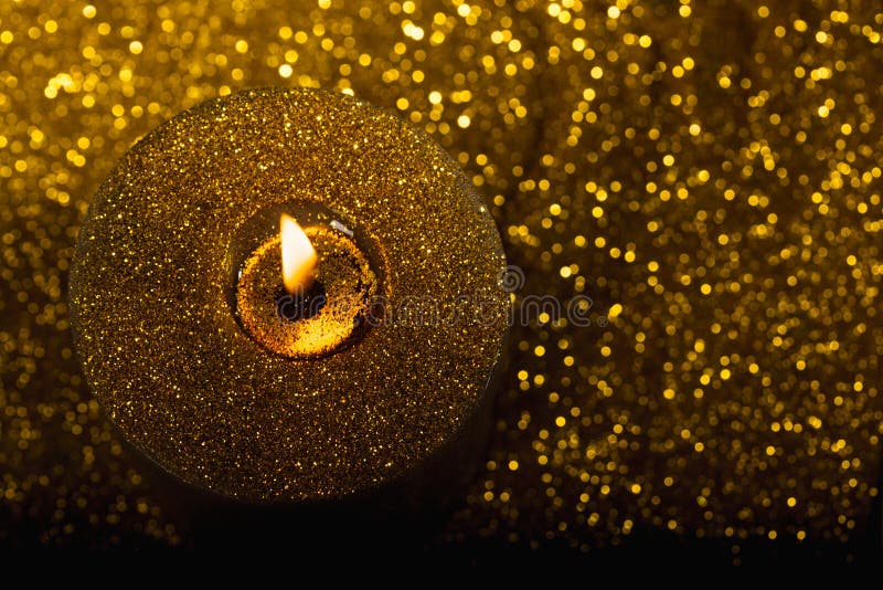 Gold christmas candle with glitter