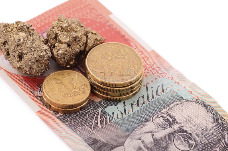 Gold and coins on Australian dollar stock photo Gold and coins on Australian dollar stock photo