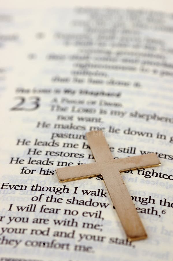 Gold cross and bible with selective focus royalty free stock photos Gold cross and bible with selective focus royalty free stock photos