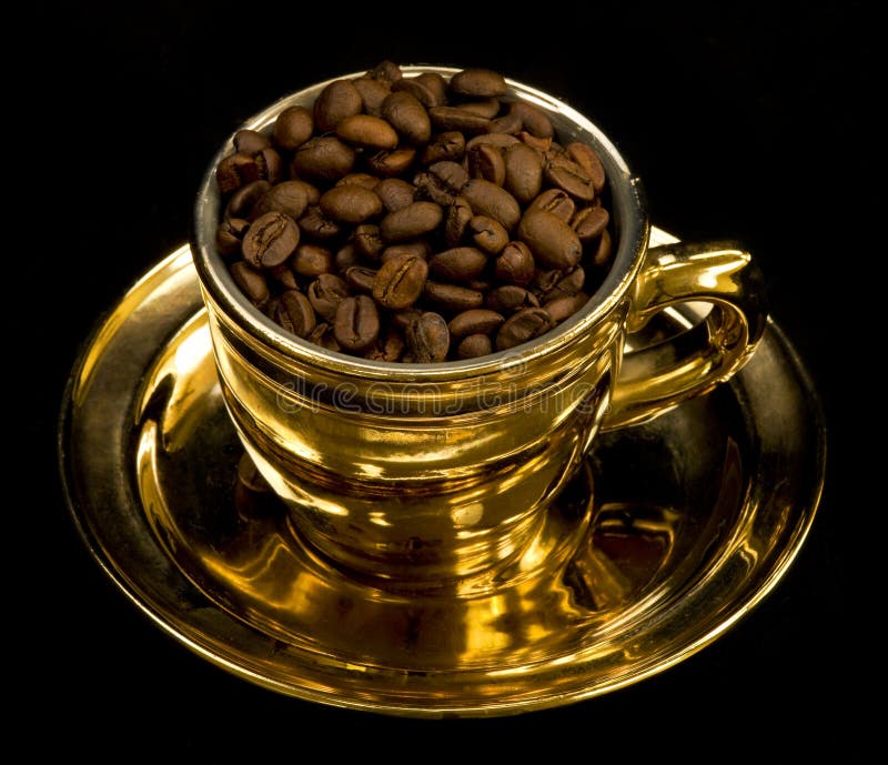 Gold cup with coffee beans