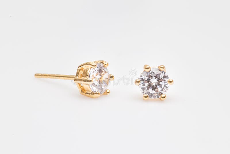Gold earrings stud with diamonds macro shot
