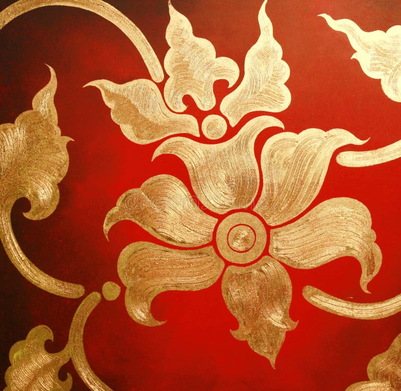 Gold flower on red wall stock photo