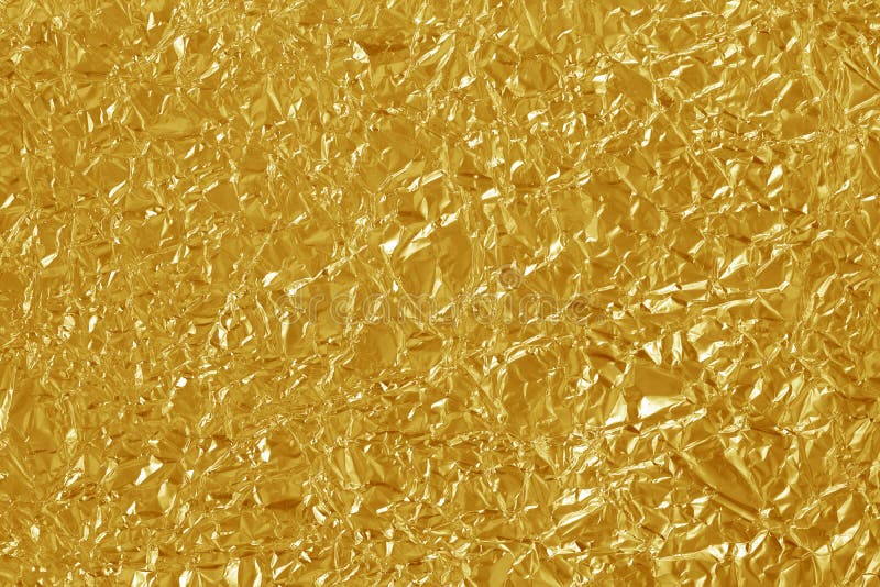 Gold foil leaf shiny texture, abstract yellow wrapping paper for