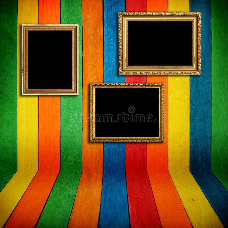 Gold frame on colorful wood