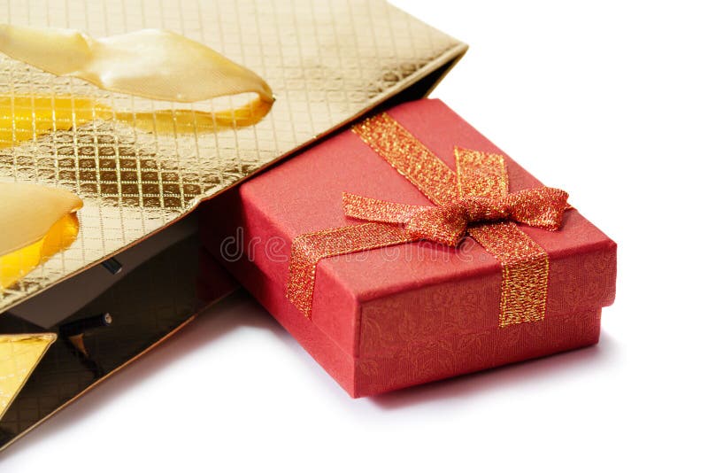 Gold Gift Bag and Red Gift Box Isolated on White. Selective Focus Stock