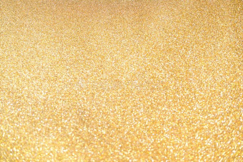 Luxury background of gold glitters. Gold dust sparkle. Gold