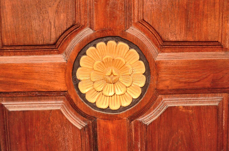 Gold graven flower on door stock photo. Image of house 60650454
