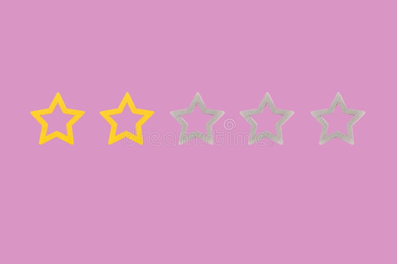 Gold, gray, silver five star shape on a pink background. The best excellent business services rating customer experience concept. Concept image of setting a five star goal,. Gold, gray, silver five star shape on a pink background. The best excellent business services rating customer experience concept. Concept image of setting a five star goal,