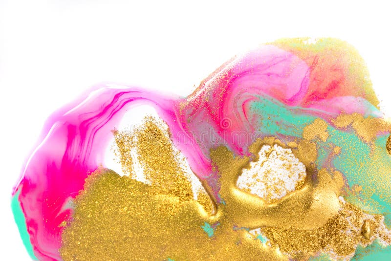 Gold, green and pink inks splattered on white paper background. Golden glitter