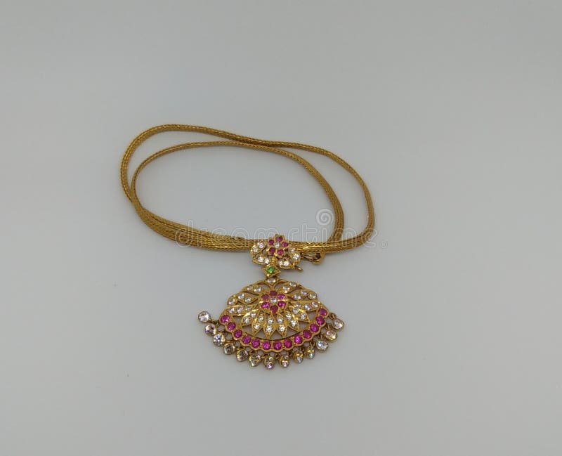 A Gold Jewellery Embedded With Red And White Gems Stock Photo Image
