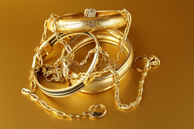 Gold jewelry, bracelets and chains stock photos Gold jewelry, bracelets and chains stock photos