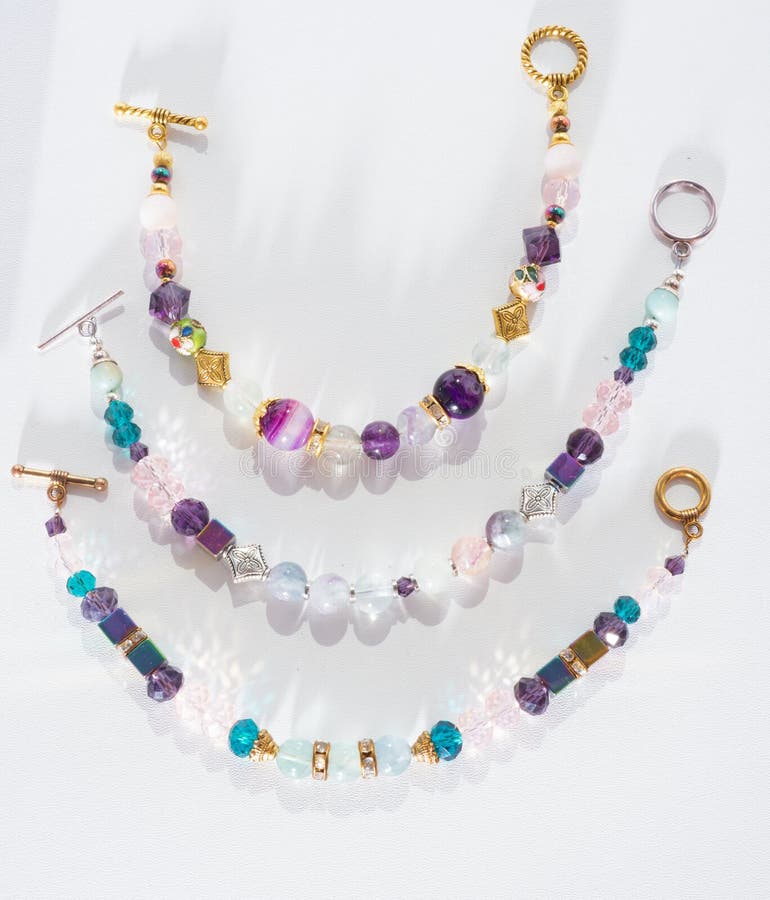 Gold jewerly braslete with semiprecious at white background stock images Gold jewerly braslete with semiprecious at white background stock images