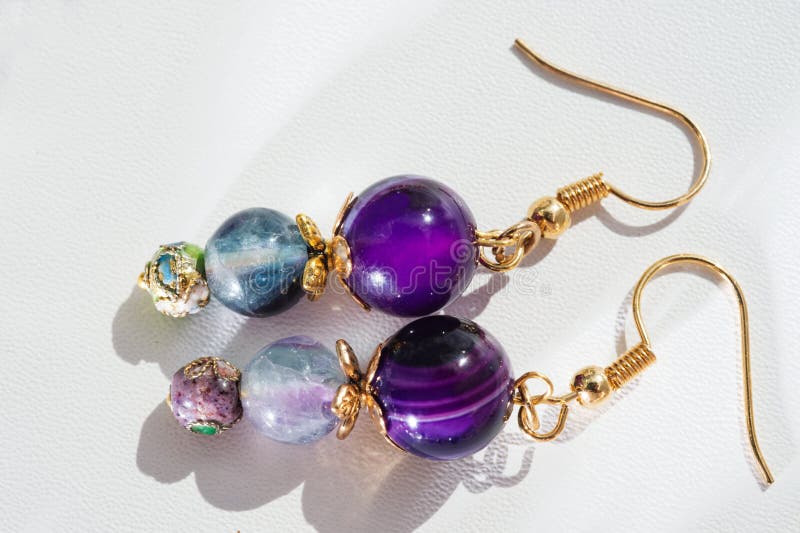 gold jewerly earrings with agat and fluorite semiprecious at white background stock image gold jewerly earrings with agat and fluorite semiprecious at white background stock image