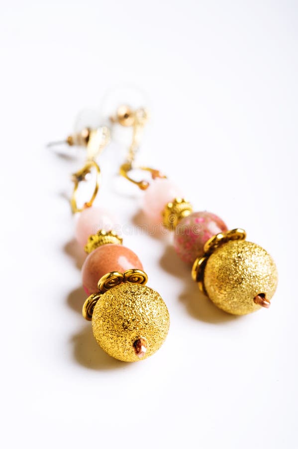 Gold jewerly earrings with semiprecious at white background royalty free stock photo Gold jewerly earrings with semiprecious at white background royalty free stock photo