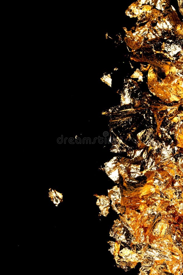 Gold Leaf Pieces Close Up on a Black Background As Decorative Pieces